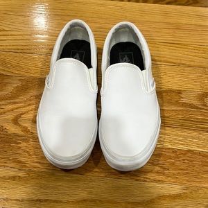 White slip-on leather Vans. Men’s size 6.5 or Women’s size 8.